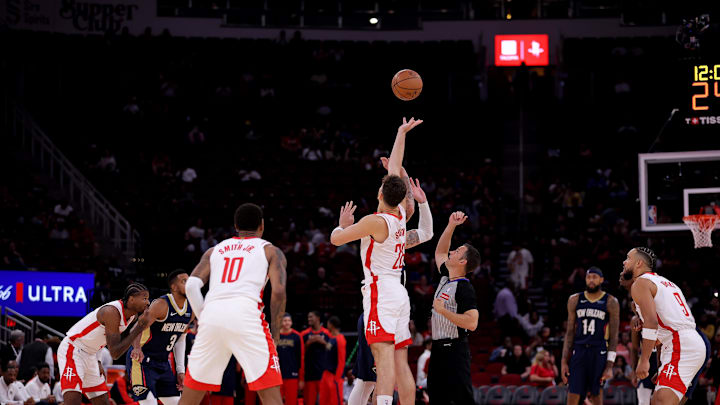 Oct 15, 2024; Houston, Texas, USA; Houston Rockets center Alperen Sengun (28) and New Orleans Pelicans center Daniel Theis (10, not shown) leap for the opening jump ball during the first quarter at Toyota Center. Mandatory Credit: Erik Williams-Imagn Images
