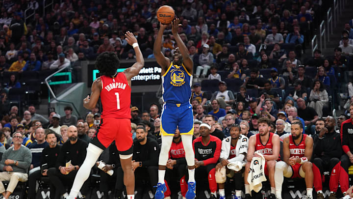 Apr 6, 2025; San Francisco, California, USA; Golden State Warriors forward Draymond Green (23) shoots over Houston Rockets forward Amen Thompson (1) in the second quarter at the Chase Center. Mandatory Credit: Cary Edmondson-Imagn Images