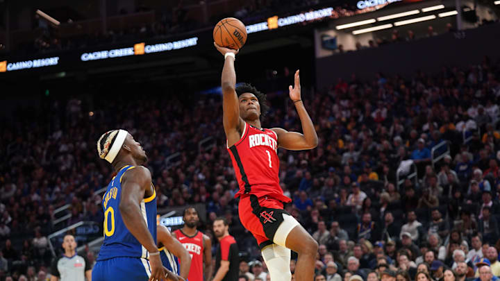 Houston Rockets forward Amen Thompson makes a shot over Golden State Warriors forward Jimmy Butler III