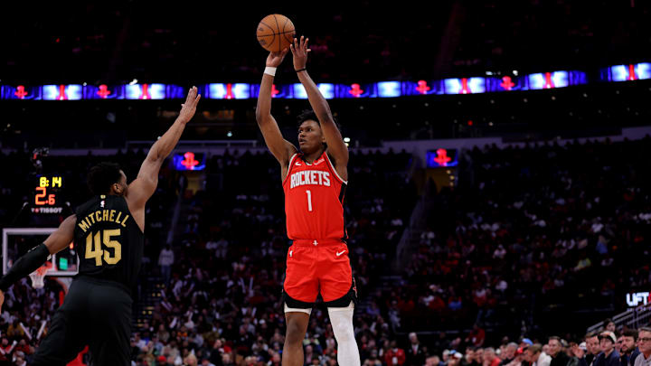 Jan 22, 2025; Houston, Texas, USA; Houston Rockets guard Amen Thompson (1) shoots inside against Cleveland Cavaliers guard Donovan Mitchell (45) during the game at Toyota Center. Mandatory Credit: Erik Williams-Imagn Images