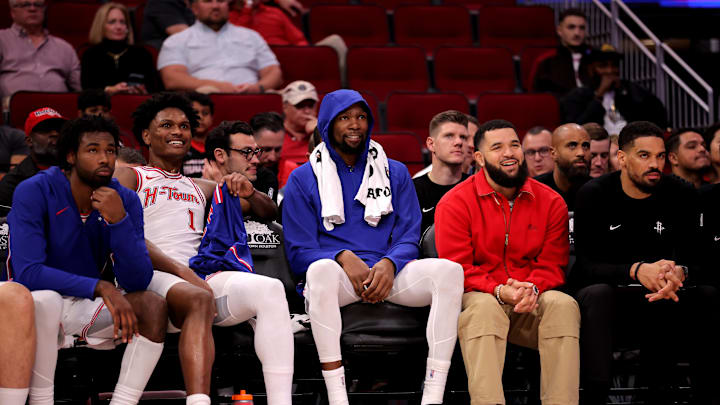 Nov 12, 2025; Houston, Texas, USA; (from L-to-R) Houston Rockets forward Tari Eason (17), guard Amen Thompson (1), forward Kevin Durant (7) and guard Fred VanVleet (5, red) on the bench against the Washington Wizards during the fourth quarter at Toyota Center. Mandatory Credit: Erik Williams-Imagn Images