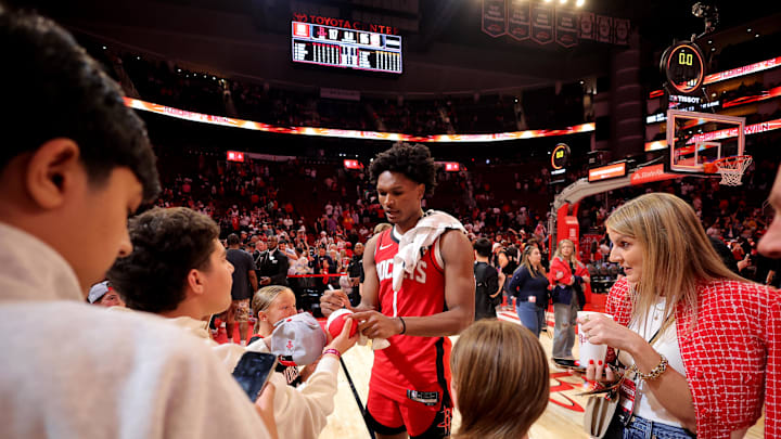 Mar 20, 2026; Houston, Texas, USA; Houston Rockets guard Amen Thompson (1) signs autographs for fans following the game against the Atlanta Hawks at Toyota Center. Mandatory Credit: Erik Williams-Imagn Images