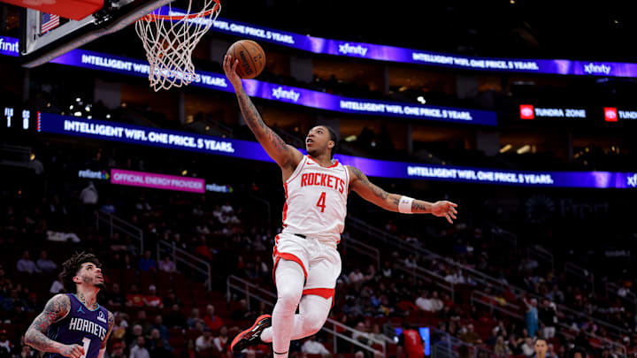 Feb 5, 2026; Houston, Texas, USA; Houston Rockets guard JD Davison (4) shoots against the Charlotte Hornets during the fourth quarter at Toyota Center. Mandatory Credit: Erik Williams-Imagn Images