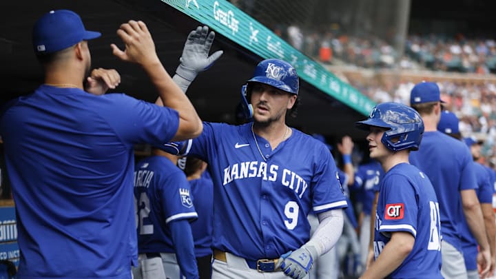 Aug 24, 2025; Detroit, Michigan, USA; Kansas City Royals first baseman Vinnie Pasquantino (9) celebrates with teammates after scoring a run in the sixth inning against the Detroit Tigers at Comerica Park. Mandatory Credit: Brian Bradshaw Sevald-Imagn Images