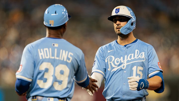Sep 20, 2025; Kansas City, Missouri, USA; Kansas City Royals outfielder Randal Grichuk (15) slaps hands with Kansas City Royals first base coach Damon Hollins (39) after getting on first base during the seventh inning against the Toronto Blue Jays at Kauffman Stadium. Mandatory Credit: William Purnell-Imagn Images Sep 20, 2025; Kansas City, Missouri, USA; Kansas City Royals outfielder Randal Grichuk (15) slaps hands with Kansas City Royals first base coach Damon Hollins (39) after getting on first base during the seventh inning against the Toronto Blue Jays at Kauffman Stadium. Mandatory Credit: William Purnell-Imagn Images