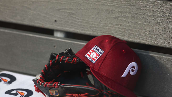 Jul 25, 2025; Bronx, New York, USA; A detailed view of a Hall of Fame patch on a Philadelphia Phillies hat resting in the dugout during the second inning against the New York Yankees at Yankee Stadium. Mandatory Credit: Vincent Carchietta-Imagn Images