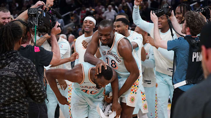 Apr 9, 2025; San Francisco, California, USA;  San Antonio Spurs center Bismack Biyombo (18) celebrates with San Antonio Spurs forward Harrison Barnes (40) after Barnes made the game-winning shot in the fourth quarter against the Golden State Warriors at Chase Center. Mandatory Credit: David Gonzales-Imagn Images