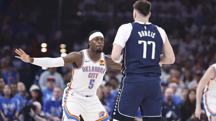 May 7, 2024; Oklahoma City, Oklahoma, USA; Oklahoma City Thunder guard Luguentz Dort (5) defends Dallas Mavericks guard Luka Doncic (77) during the first quarter of game one of the second round for the 2024 NBA playoffs at Paycom Center. Mandatory Credit: Alonzo Adams-USA TODAY Sports