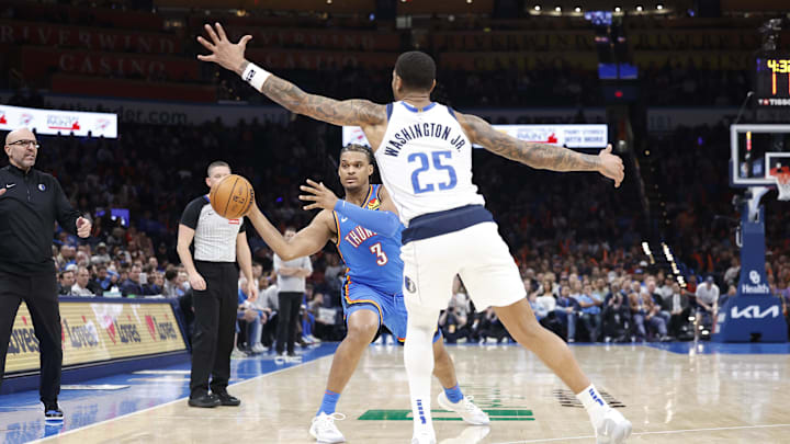 Jan 23, 2025; Oklahoma City, Oklahoma, USA; Oklahoma City Thunder forward Dillon Jones (3) passes the ball as Dallas Mavericks forward P.J. Washington (25) defends during the second half at Paycom Center. Mandatory Credit: Alonzo Adams-Imagn Images