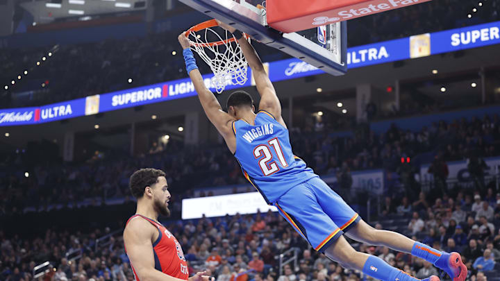 Feb 10, 2025; Oklahoma City, Oklahoma, USA; Oklahoma City Thunder guard Aaron Wiggins (21) dunks in front of New Orleans Pelicans forward Jeremiah Robinson-Earl (50) during the second quarter at Paycom Center. Mandatory Credit: Alonzo Adams-Imagn Images