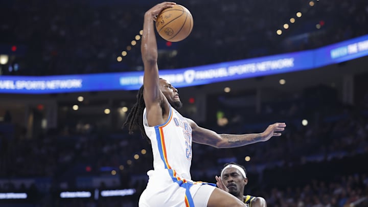 Mar 29, 2025; Oklahoma City, Oklahoma, USA; Oklahoma City Thunder guard Cason Wallace (22) goes up for a dunk against the Indiana Pacers during the second quarter at Paycom Center. Mandatory Credit: Alonzo Adams-Imagn Images Mar 29, 2025; Oklahoma City, Oklahoma, USA; Oklahoma City Thunder guard Cason Wallace (22) goes up for a dunk against the Indiana Pacers during the second quarter at Paycom Center. Mandatory Credit: Alonzo Adams-Imagn Images