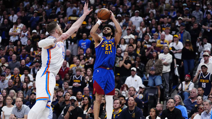 May 9, 2025; Denver, Colorado, USA; Oklahoma City Thunder center Isaiah Hartenstein (55) defends on Denver Nuggets guard Jamal Murray (27) in the overtime during game three of the second round for the 2025 NBA Playoffs at Ball Arena. Mandatory Credit: Ron Chenoy-Imagn Images May 9, 2025; Denver, Colorado, USA; Oklahoma City Thunder center Isaiah Hartenstein (55) defends on Denver Nuggets guard Jamal Murray (27) in the overtime during game three of the second round for the 2025 NBA Playoffs at Ball Arena. Mandatory Credit: Ron Chenoy-Imagn Images