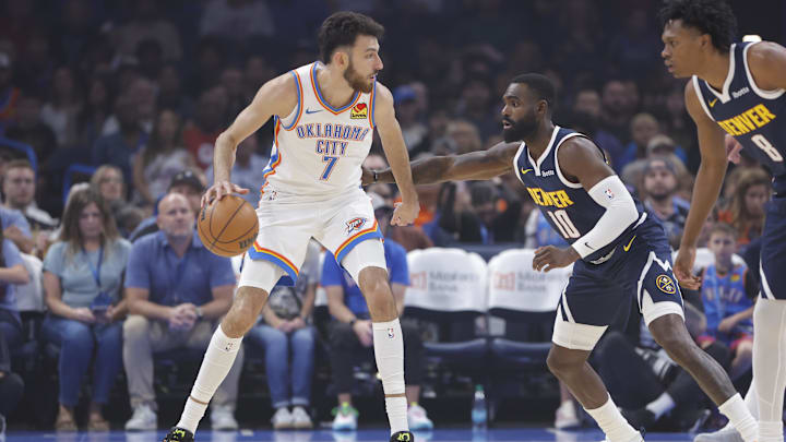 Oct 17, 2025; Oklahoma City, Oklahoma, USA; Oklahoma City Thunder center/forward Chet Holmgren (7) moves the ball as Denver Nuggets guard/forward Tim Hardaway Jr. (10) defends during the first quarter at Paycom Center. Mandatory Credit: Alonzo Adams-Imagn Images Oct 17, 2025; Oklahoma City, Oklahoma, USA; Oklahoma City Thunder center/forward Chet Holmgren (7) moves the ball as Denver Nuggets guard/forward Tim Hardaway Jr. (10) defends during the first quarter at Paycom Center. Mandatory Credit: Alonzo Adams-Imagn Images