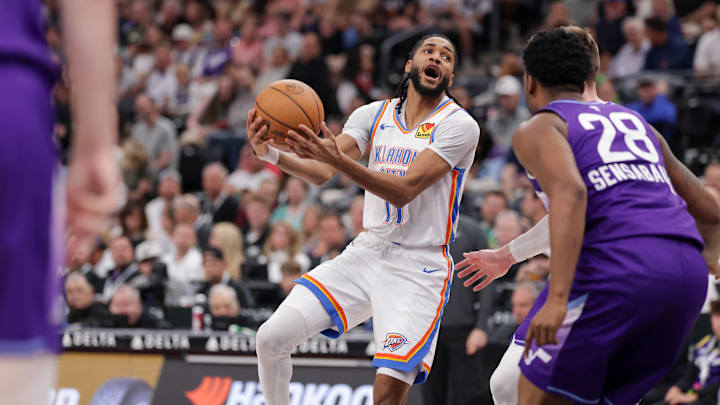 Apr 11, 2025; Salt Lake City, Utah, USA;  Oklahoma City Thunder guard Isaiah Joe (11) tries to past the ball against the Utah Jazz during the second quarter at Delta Center. Mandatory Credit: Chris Nicoll-Imagn Images