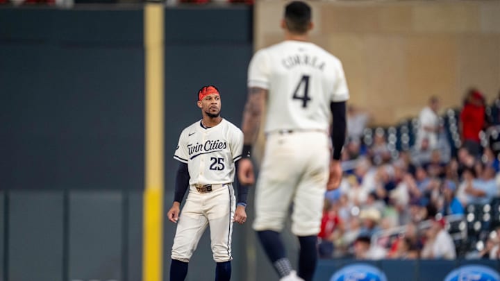 Sep 26, 2024; Minneapolis, Minnesota, USA; Minnesota Twins outfielder Byron Buxton (25) is stranded on base after Minnesota Twins shortstop Carlos Correa (4) strikes out to end the seventh inning against the Miami Marlins at Target Field. Mandatory Credit: Matt Blewett-Imagn Images