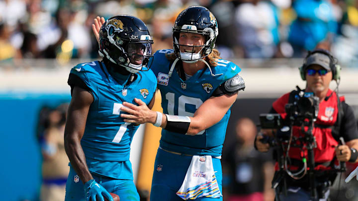 Jacksonville Jaguars quarterback Trevor Lawrence (16) congratulates wide receiver Brian Thomas Jr. (7) on his touchdown score during the third quarter of an NFL football matchup Sunday, Oct. 27, 2024 at EverBank Stadium in Jacksonville, Fla. The Packers edged the Jaguars 30-27 on a last-second field goal. [Corey Perrine/Florida Times-Union]