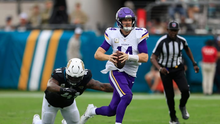 Minnesota Vikings quarterback Sam Darnold (14) is pressured by Jacksonville Jaguars defensive end Josh Hines-Allen (41) during the second quarter an NFL football matchup Sunday, Nov. 10, 2024 at Everbank Stadium in Jacksonville, Fla. Minnesota Vikings quarterback Sam Darnold (14) is pressured by Jacksonville Jaguars defensive end Josh Hines-Allen (41) during the second quarter an NFL football matchup Sunday, Nov. 10, 2024 at Everbank Stadium in Jacksonville, Fla.