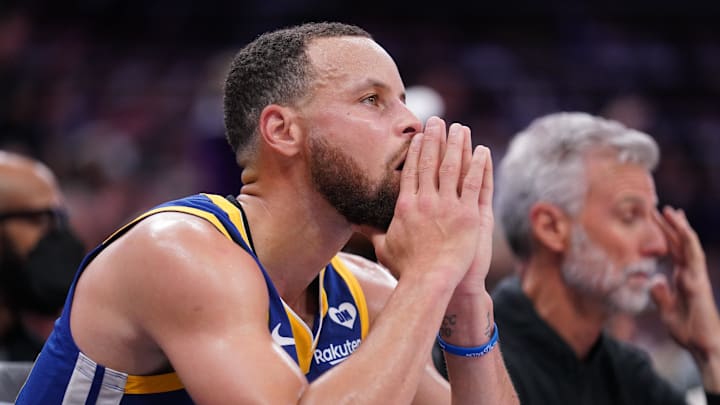 Golden State Warriors guard Stephen Curry (30) sits on the bench during action against the Sacramento Kings in the fourth quarter during a play-in game of the 2024 NBA playoffs at the Golden 1 Center. Mandatory Credit: Cary Edmondson-Imagn Images