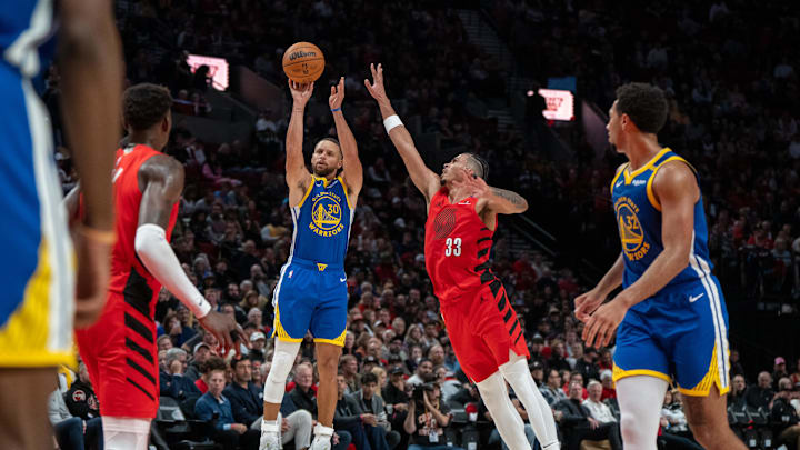  Golden State Warriors point guard Stephen Curry (30) shoots the ball against Portland Trailblazers forward Toumani Camara (33) during the second half at Moda Center. Mandatory Credit: Stephen Brashear-Imagn Images