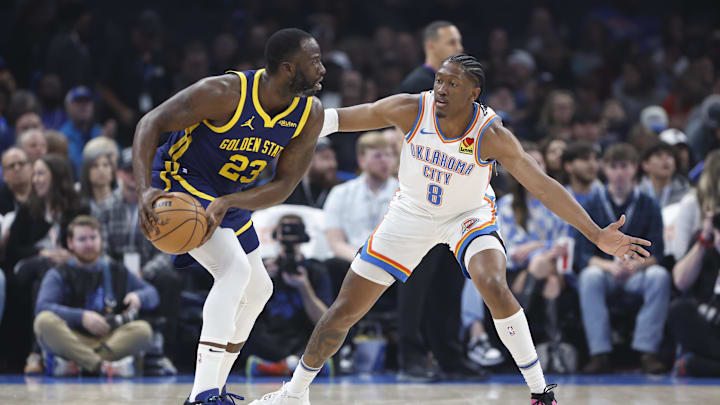 Dec 8, 2023; Oklahoma City, Oklahoma, USA; Oklahoma City Thunder forward Jalen Williams (8) defends Golden State Warriors forward Draymond Green (23) during the first quarter at Paycom Center. Mandatory Credit: Alonzo Adams-Imagn Images