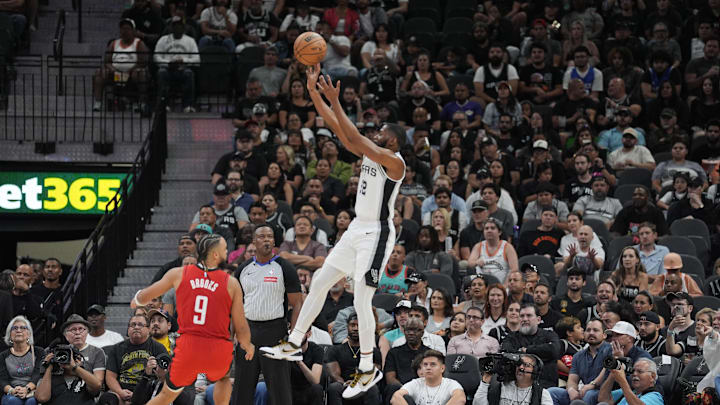 Oct 26, 2024; San Antonio, Texas, USA;  San Antonio Spurs guard Malaki Branham (22) shoots over Houston Rockets forward Dillon Brooks (9) in the first half at Frost Bank Center. Mandatory Credit: Daniel Dunn-Imagn Images