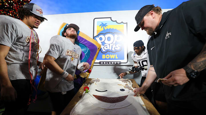 Dec 28, 2024; Orlando, FL, USA; Iowa State Cyclones quarterback Rocco Becht (3) celebrates after beating Miami Hurricanes in the Pop Tarts bowl at Camping World Stadium. Mandatory Credit: Nathan Ray Seebeck-Imagn Images