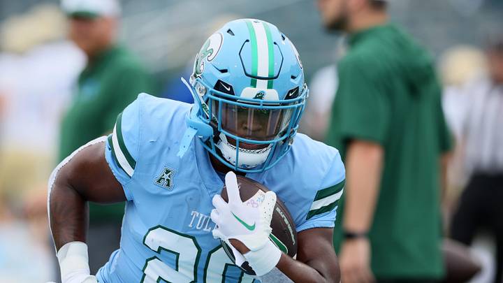Nov 11, 2023; New Orleans, Louisiana, USA; Tulane Green Wave running back Arnold Barnes III (20) warms up before their game against the Tulsa Golden Hurricanes at Yulman Stadium. 