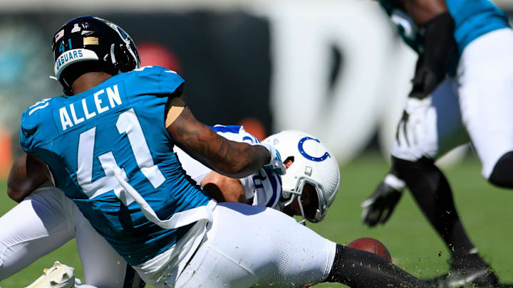 Jacksonville Jaguars linebacker Josh Allen (41) commits a fumble turnover against Indianapolis Colts quarterback Gardner Minshew (10) during the second quarter of an NFL football matchup Sunday, Oct. 15, 2023 at EverBank Stadium in Jacksonville, Fla. The Jacksonville Jaguars defeated the Indianapolis Colts 37-20. [Corey Perrine/Florida Times-Union]
