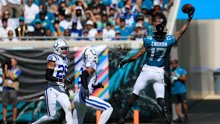 Jacksonville Jaguars tight end Evan Engram (17) makes a one-handed reception as Indianapolis Colts safety Julian Blackmon (32) and cornerback JuJu Brents (29) look on during the second quarter of an NFL football matchup Sunday, Oct. 15, 2023 at EverBank Stadium in Jacksonville, Fla. The Jacksonville Jaguars defeated the Indianapolis Colts 37-20. [Corey Perrine/Florida Times-Union]