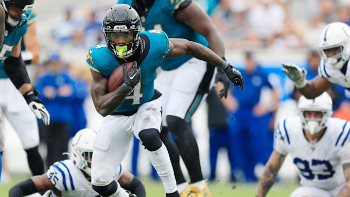 Jacksonville Jaguars running back Tank Bigsby (4) rushes for yards during the fourth quarter of an NFL football matchup Sunday, Oct. 6, 2024 at EverBank Stadium in Jacksonville, Fla. The Jaguars edged the Colts on a field goal 37-34. [Corey Perrine/Florida Times-Union]