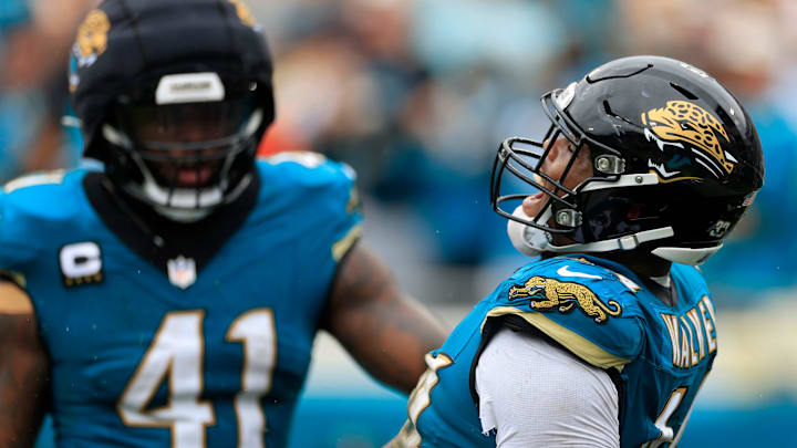 Jacksonville Jaguars defensive end Travon Walker (44) reacts to forcing a fumble with defensive end Josh Hines-Allen (41) during the second quarter of an NFL football matchup Sunday, Oct. 6, 2024 at EverBank Stadium in Jacksonville, Fla. [Corey Perrine/Florida Times-Union]