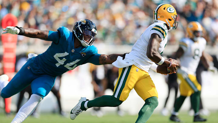 Jacksonville Jaguars defensive end Travon Walker (44) can’t stop Green Bay Packers quarterback Malik Willis (2) during the third quarter of an NFL football matchup Sunday, Oct. 27, 2024 at EverBank Stadium in Jacksonville, Fla. The Packers edged the Jaguars 30-27 on a last-second field goal. [Corey Perrine/Florida Times-Union]