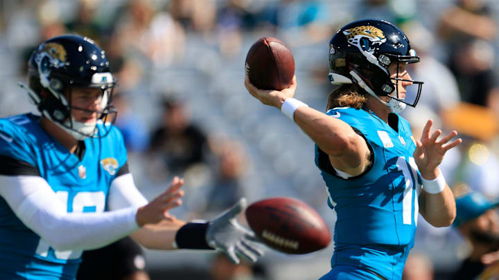 Jacksonville Jaguars quarterback Trevor Lawrence (16) warms up next to quarterback Mac Jones (10) before an NFL football matchup Sunday, Oct. 27, 2024 at EverBank Stadium in Jacksonville, Fla. [Corey Perrine/Florida Times-Union]