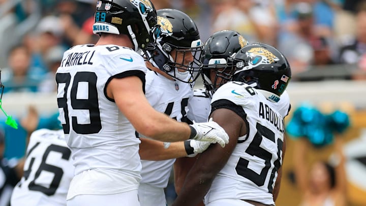 Jacksonville Jaguars linebacker Yasir Abdullah (56) is celebrated by linebacker Chad Muma (48) on his defensive stop with tight end Luke Farrell (89) during the first quarter of an NFL football matchup Sunday, Sept. 15, 2024 at EverBank Stadium in Jacksonville, Fla. The Browns defeated the Jaguars 18-13. [Corey Perrine/Florida Times-Union]