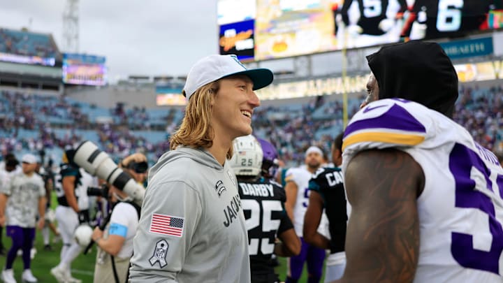Jacksonville Jaguars quarterback Trevor Lawrence (16) greets Minnesota Vikings linebacker Jihad Ward (52) after the game of an NFL football matchup Sunday, Nov. 10, 2024 at Everbank Stadium in Jacksonville, Fla. The Vikings defeated the Jaguars 12-7. [Corey Perrine/Florida Times-Union]