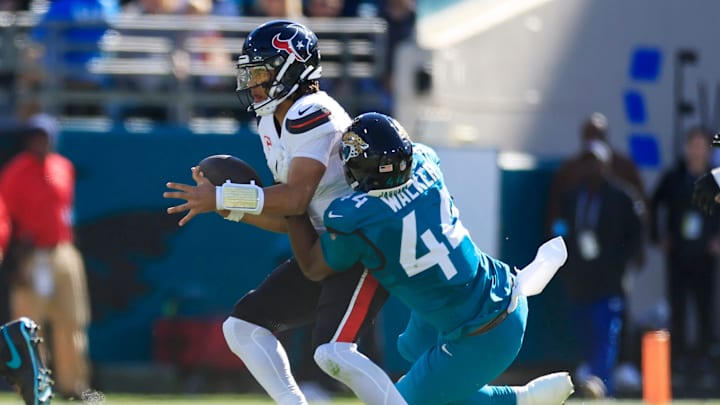 Jacksonville Jaguars defensive end Travon Walker (44) sacks Houston Texans quarterback C.J. Stroud (7) during the first quarter of an NFL football matchup Sunday, Dec. 1, 2024 at EverBank Stadium in Jacksonville, Fla. [Corey Perrine/Florida Times-Union]