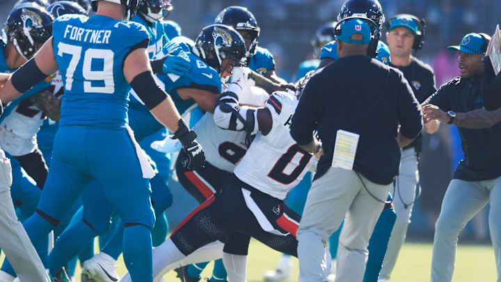 Jacksonville Jaguars tight end Brenton Strange (85) goes after Houston Texans linebacker Azeez Al-Shaair (0) after a late hit on Jacksonville Jaguars quarterback Trevor Lawrence during the second quarter of an NFL football matchup Sunday, Dec. 1, 2024 at EverBank Stadium in Jacksonville, Fla. [Corey Perrine/Florida Times-Union]