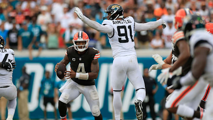 Cleveland Browns quarterback Deshaun Watson (4) runs past Jacksonville Jaguars defensive end Arik Armstead (91) during the fourth quarter of an NFL football matchup Sunday, Sept. 15, 2024 at EverBank Stadium in Jacksonville, Fla. The Browns defeated the Jaguars 18-13. [Corey Perrine/Florida Times-Union]