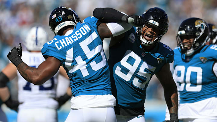 Jacksonville Jaguars linebacker K'Lavon Chaisson (45) is congratulated by Jacksonville Jaguars defensive end Roy Robertson-Harris (95) for his tackle on Indianapolis Colts quarterback Gardner Minshew (10), not shown, during the third quarter of an NFL football matchup Sunday, Oct. 15, 2023 at EverBank Stadium in Jacksonville, Fla. The Jacksonville Jaguars defeated the Indianapolis Colts 37-20. [Corey Perrine/Florida Times-Union]