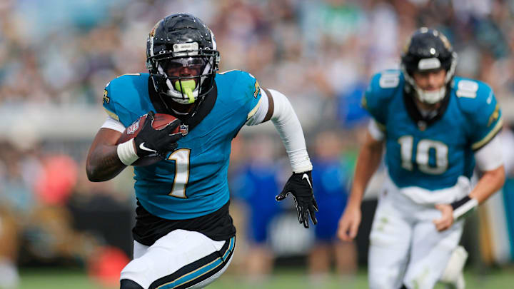Jacksonville Jaguars running back Travis Etienne Jr. (1) rushes for yards during the second quarter Sunday, Dec. 15, 2024 at EverBank Stadium in Jacksonville, Fla. [Corey Perrine/Florida Times-Union]