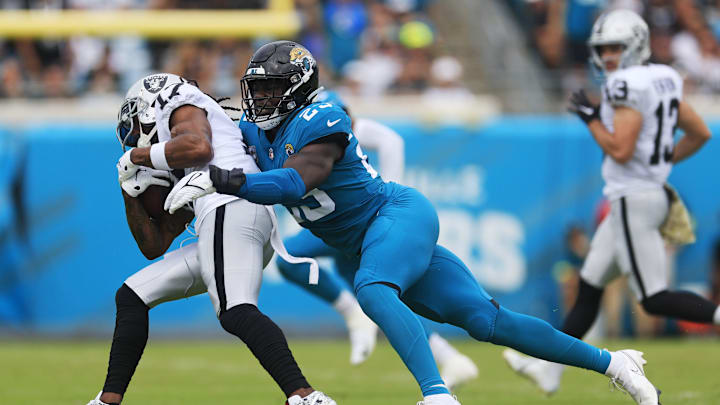 Jacksonville Jaguars linebacker Foyesade Oluokun (23) tackles Las Vegas Raiders wide receiver Davante Adams (17) during the first quarter of a regular season NFL football matchup Sunday, Nov. 6, 2022 at TIAA Bank Field in Jacksonville. The Jacksonville Jaguars held off the Las Vegas Raiders 27-20. [Corey Perrine/Florida Times-Union]

Jki 110622 Raiders Jags Cp 50