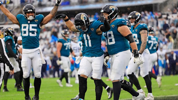 Jacksonville Jaguars wide receiver Parker Washington (11) celebrates his touchdown with guard Brandon Scherff (68) and tight end Brenton Strange (85) during the second quarter of an NFL football matchup Sunday, Dec. 29, 2024 at EverBank Stadium in Jacksonville, Fla. [Corey Perrine/Florida Times-Union]