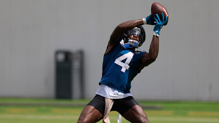 Jacksonville Jaguars running back Tank Bigsby (4) catches a pass during a combined NFL football training camp session between the Tampa Bay Buccaneers and Jacksonville Jaguars Thursday, Aug. 15, 2024 at EverBank Stadium’s Miller Electric Center in Jacksonville, Fla. [Corey Perrine/Florida Times-Union]
