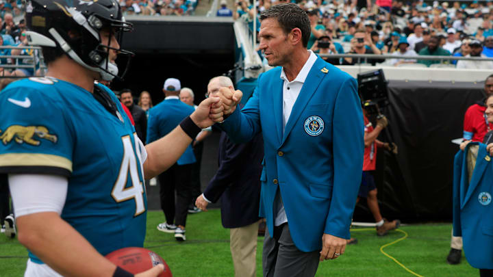 Jacksonville Jaguars hall-of-fame and former offensive tackle, Tony Boselli, fist bumps long snapper Ross Matiscik (46) during the second quarter of an NFL football matchup Sunday, Oct. 6, 2024 at EverBank Stadium in Jacksonville, Fla. Coughlin was inducted into the ring of honor at halftime. The Jaguars edged the Colts on a field goal 37-34. [Corey Perrine/Florida Times-Union]