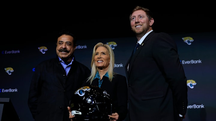 Jaguars owner Shad Khan, from left, Jacksonville Mayor Donna Deegan, and new Jacksonville Jaguars head coach Liam Coen pose for a photo after speaking and being introduced during a press conference Monday, Jan. 27, 2025 at the Miller Electric Center in Jacksonville, Fla. [Corey Perrine/Florida Times-Union]