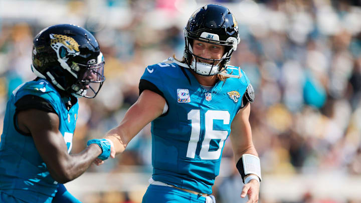 Jacksonville Jaguars quarterback Trevor Lawrence (16) congratulates wide receiver Brian Thomas Jr. (7) on his touchdown score during the third quarter of an NFL football matchup Sunday, Oct. 27, 2024 at EverBank Stadium in Jacksonville, Fla. The Packers edged the Jaguars 30-27 on a last-second field goal. [Corey Perrine/Florida Times-Union]