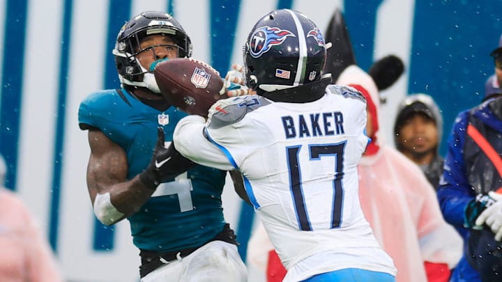Jacksonville Jaguars running back Tank Bigsby (4) can’t haul in a reception against Tennessee Titans linebacker Jerome Baker (17) during the second quarter of an NFL football matchup Sunday, Dec. 29, 2024 at EverBank Stadium in Jacksonville, Fla. [Corey Perrine/Florida Times-Union]