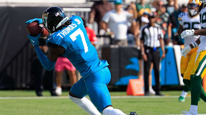Jacksonville Jaguars wide receiver Brian Thomas Jr. (7) corrals the ball for a touchdown score during the third quarter of an NFL football matchup Sunday, Oct. 27, 2024 at EverBank Stadium in Jacksonville, Fla. The Packers edged the Jaguars 30-27 on a last-second field goal. [Corey Perrine/Florida Times-Union]