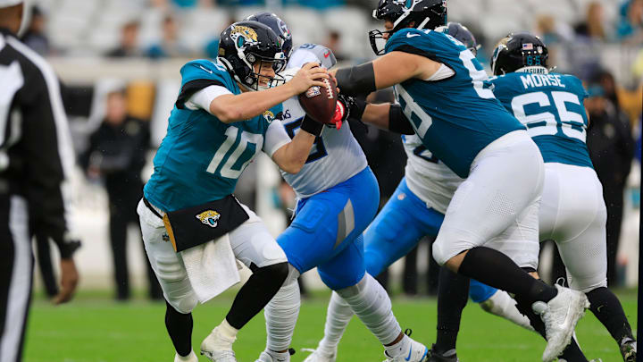 Jacksonville Jaguars quarterback Mac Jones (10) escapes the pocket during the first quarter of an NFL football matchup Sunday, Dec. 29, 2024 at EverBank Stadium in Jacksonville, Fla. [Corey Perrine/Florida Times-Union]