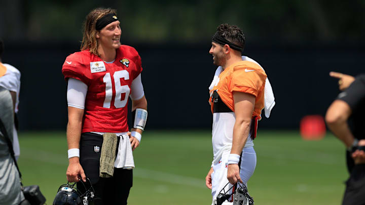 Jacksonville Jaguars quarterback Trevor Lawrence (16), left, talks with Tampa Bay Buccaneers quarterback Baker Mayfield (6) during a combined NFL football training camp session between the Tampa Bay Buccaneers and Jacksonville Jaguars Wednesday, Aug. 14, 2024 at EverBank Stadium’s Miller Electric Center in Jacksonville, Fla. [Corey Perrine/Florida Times-Union]